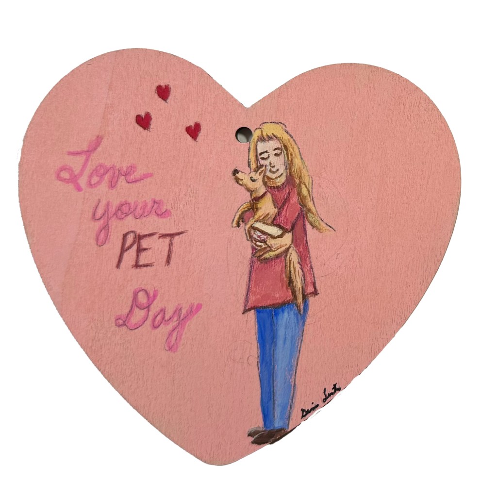 Pink Heart shaped art done on a purchased wooden heart. Love your Pet Day.  Woman holding and hugging her dog.