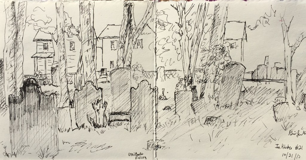 A pen and ink sketch depicting a cemetery with gravestones, surrounded by trees and two houses in the background.